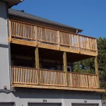 Wooden railings on a two tier deck